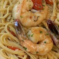 Shrimp Scampi Linguine · Wild jumbo shrimp, lemon, butter, garlic, white wine and san marzano tomatoes.