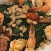 Shrimp Toscana · Grilled shrimp served over cannellini beans, tomatoes, wilted spinach on a white bean purée ...