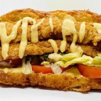 Whiting Po'Boy · Fried Whiting on a sandwich served with lettuce, tomato, and chipotle mayo.
