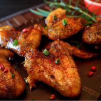 Cajun Wings · Fresh and organic wings, breaded in our own seasoned flour blend. Tossed with Cajun dry rub....