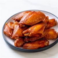 Buffalo Wings · Delectable and organic wings tossed with spicy buffalo sauce. Served with your choice of ble...
