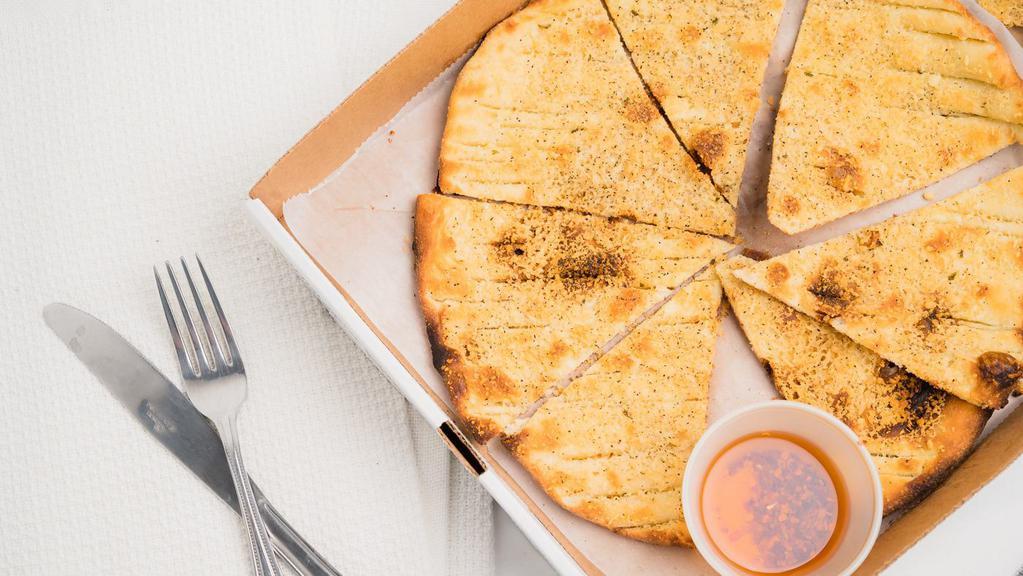 Focaccia · Thinly baked Durham wheat with olive oil, herbs and parmigiano cheese.