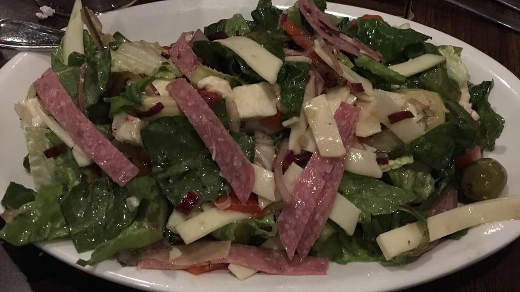 Brick Oven Antipasto Salad For 1 · Antipasto salad with romaine lettuce, tomatoes, onions, roasted peppers, artichoke hearts, green olives, salami, provolone and mozzarella cheese with a homemade Italian dressing. * 
 
*Popular