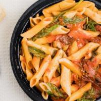 Penne Alla Roberto · Penne with sundried tomatoes and arugula in fresh squeezed tomato sauce and olive oil. Serve...