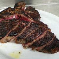 Prime 40-Day Dry-Aged Porterhouse (40 Oz.) · Charred red onion