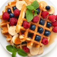 Homestyle Waffles With Mixed Berries · Hot & Tasty Homestyle waffles, served hot off the griddle. Topped with fresh mixed berries, ...