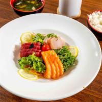 American Sashimi Combo · Four pieces each of tuna, salmon, yellowtail with white rice on the side.