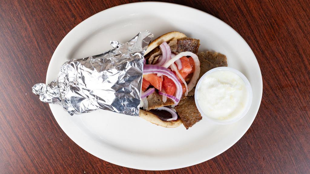 #3 Gyro Sandwich & Side Salad · Slices of beef and lamb mix on pita topped with tomatoes and onions, tzatziki sauce on the side and served with a side salad (lettuce, tomato, cucumbers, feta cheese, vinaigrette dressing).