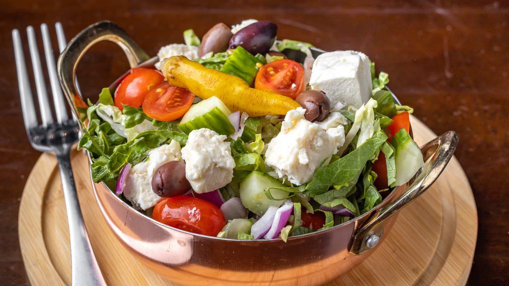 Chopped Salad · Vegetarian. Feta, cucumber, olives, peppers, cherry tomatoes, red onion.