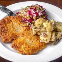Pork Schnitzel · Red cabbage slaw, potato salad, creamy mustard.