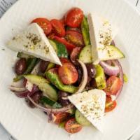 The Villager · Fresh tomatoes and imported feta in a classic greek village salad, exactly as if you were th...