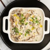 The Gyro Bowl · Chicken or pork gyro stewed with onion, mushroom in a creamy yogurt sauce served on a bed of...