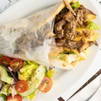 The Gyro · Real Chicken or pork gyro sliced straight from the spit, fries, tzatziki, romaine, tomato in...