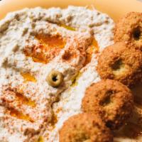 Maza Platter · A combination of hummus, baba-ghanoush, and falafel.