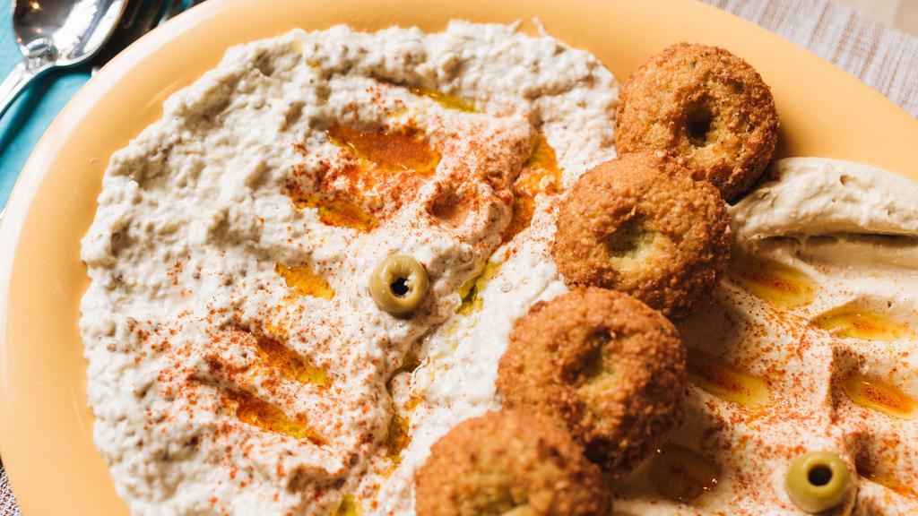 Maza Platter · A combination of hummus, baba-ghanoush, and falafel.