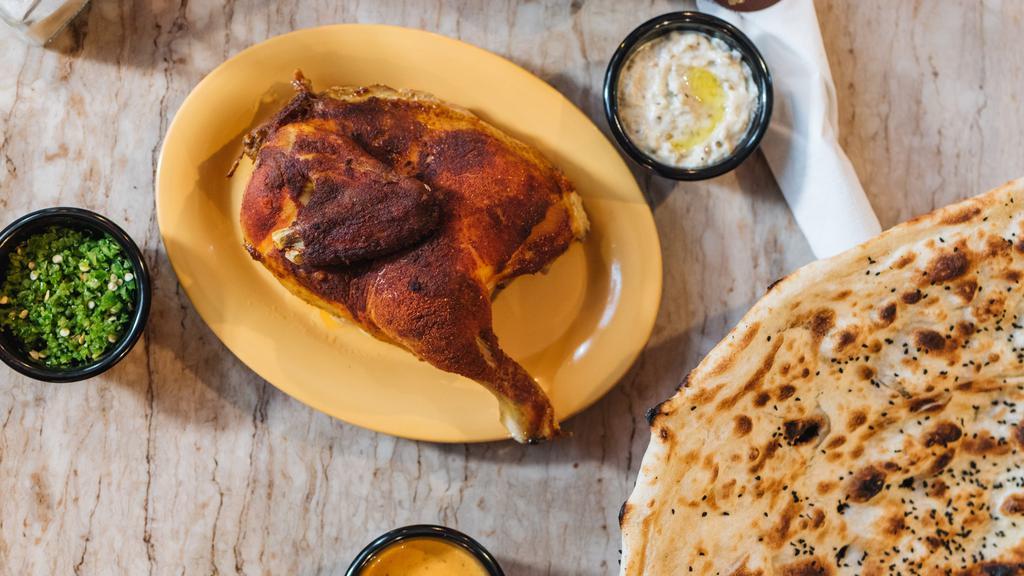 Chicken Muhamar (Roasted Chicken) · (Half) Chicken, seasoned with hadramout's imported seasoning, and slow-roasted to perfection, served with a Large Fresh Tandoori Rashoosh flat-bread.