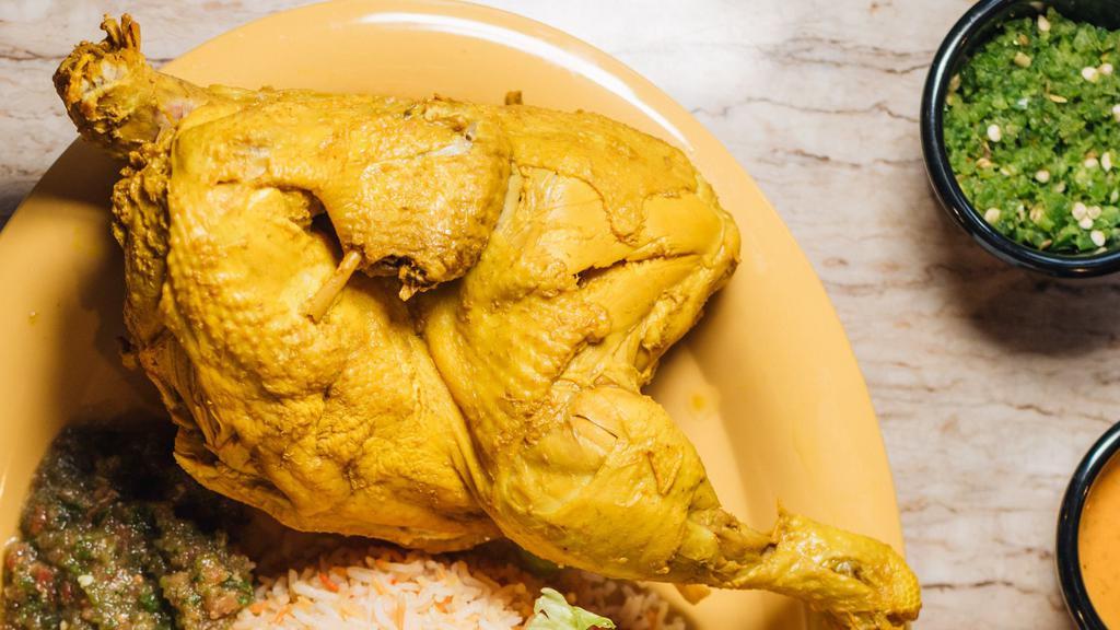 Chicken Maslook (Boiled Chicken) · (Half) chicken boiled with a flavor base made from diced vegetables, served with a large fresh tandoori rashoosh flat-bread.