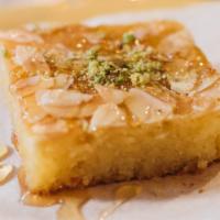Basboosa · Semolina flour, mixed with granulated coconut, butter, milk, and syrup; baked and topped wit...