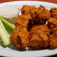 Boneless Wings (10 Pieces) · Boneless Wing -All white meat fried and tossed in Original Anchor Bar Wing Sauce, served wit...