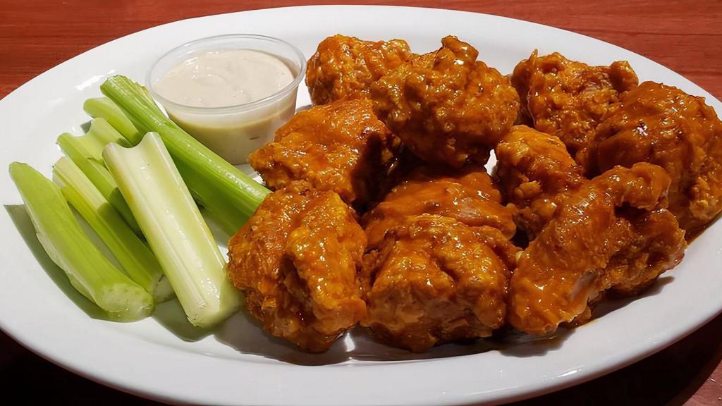 Boneless Wings (50 Pieces) · Boneless Wing -All white meat fried and tossed in Original Anchor Bar Wing Sauce, served with celery and Anchor Bar Bleu cheese dressing or ranch dressing.