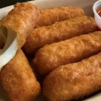 Mozzarella Stix (6 Pieces) · Breaded and fried gooey mozzarella sticks served with a side of pizza sauce.
