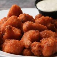 Cauliflower Wing (10 Oz.) · Breaded cauliflower deep fried til golden brown.  Served plain or tossed in your favorite An...