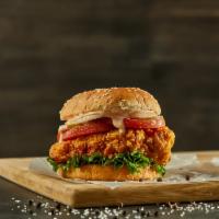 Spicy Crispy Fried Chicken Sandwich · Spicy crispy fried chicken on a brioche bun topped with cheese, tomato, coleslaw, pickles, a...