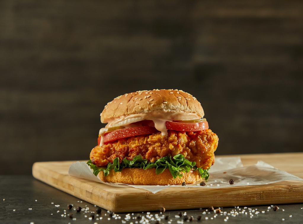 Spicy Crispy Fried Chicken Sandwich · Spicy crispy fried chicken on a brioche bun topped with cheese, tomato, coleslaw, pickles, and bang bang sauce