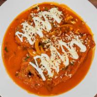 Chiles Rellenos · Stuffed peppers served with rice and beans, and tortillas or bread.