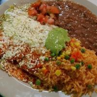Enchiladas De Mole (3) · Three corn tortillas filled with your choice of meat and sauce topped with guacamole, pico d...