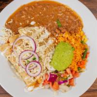 Quesadillas De Pollo · Chicken quesadillas. Three corn tortillas filled with your choice of meat topped with guacam...