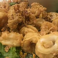 Fried Calamari · Flash fried squid, crunchy on the outside and simply perfect on the inside. Kick it up a not...