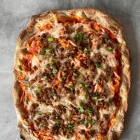 Beyond Pinsa (Vegan) · San marzano tomatoes sauce, vegan mozzarella, vegan sausage (Beyond), scallions.