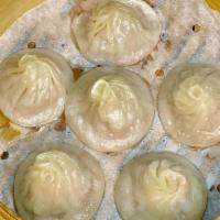Crab Soup Soup Dumpling · filled with pork and crab, accompanied with black vinegar and ginger