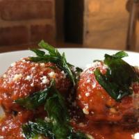 Polpette Meatballs · Pork meatballs, golden rasin, parmigiano, and pomodoro sauce.