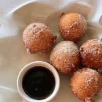 Bomboloni · Italian ricotta donuts, lavender infused sugar, and warm chocolate sauce.