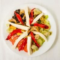 Roma Salad  · Romaine lettuce, tomatoes, onions, olives, cucumbers, olives, roasted peppers, and fresh moz...