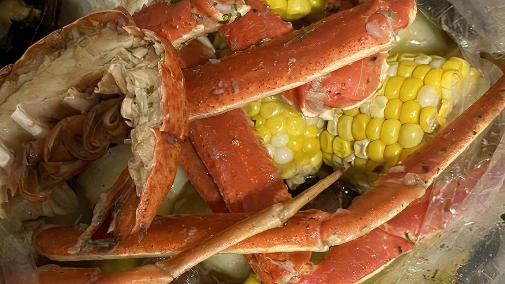 Boil Bag · Snow crab legs, shrimp, mussels, clams, calamari, scallops, corn and potatoes.