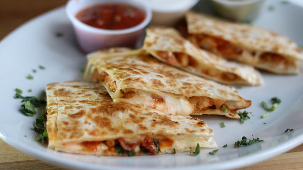Fajita Quesadilla · Flour tortilla with your choice of steak, chicken slices or chorizo with bell peppers, onions, tomatoes and cheese. Served with sour cream, guacamole pico de gallo, rice and beans.