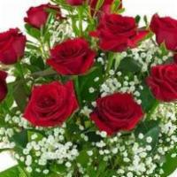 A Dozen Red Roses · 1 dozen premium red roses deigned in a quality tall glass vase.