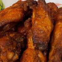 Peek Gai Yang Ka Min (Crispy Chicken Wings) · Deep-fried chicken wings marinated with sea salt, turmeric, garlic, fish sauce.
