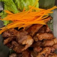 Moo Yang (Pork Tenderloin) · BBQ pork marinated with '3 musketeers' (cilantro, garlic, black pepper).