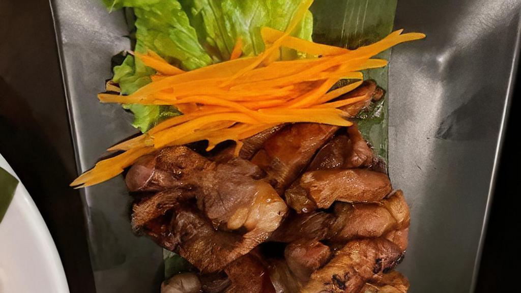 Moo Yang (Pork Tenderloin) · BBQ pork marinated with '3 musketeers' (cilantro, garlic, black pepper).