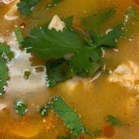 Tom Yum Nam Khon (Hot And Sour Soup) · Spicy. Thai hot and sour soup with lemongrass, galangal, lime leaves, coconut milk. (Chicken...