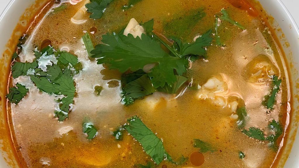 Tom Yum Nam Khon (Hot And Sour Soup) · Spicy. Thai hot and sour soup with lemongrass, galangal, lime leaves, coconut milk. (Chicken) (Shrimp) for an extra charge.