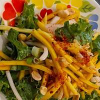 Yum Mamuang (Mango Salad) · Spicy, and vegetarian. Fresh mango, Thai chili powder, fish sauce, lime juice, plum sugar, c...