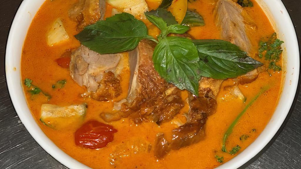 Kaeng Phed Ped Yang (Duck Breast) · Spicy. Roasted duck breast simmered in red curry paste with coconut milk, Thai baby eggplant, jackfruit, mandarin orange.