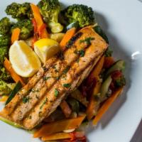 Grilled Salmon · Served with spinach, broccoli, garlic and oil.