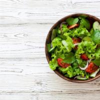 Mixed Green Salad · Fresh salad with various greens and a choice of dressing.
