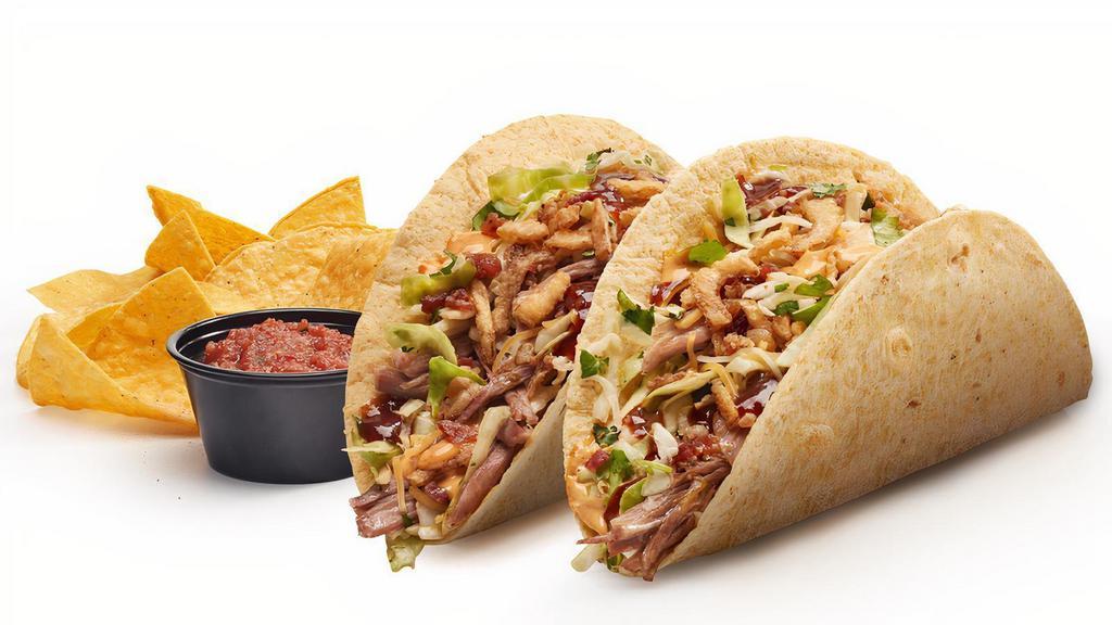 New! Dos Chipotle Bbq Pork Tacos · Carnitas style pork, bacon, chipotle BBQ sauce, spicy mayo, crispy onions, chipotle slaw, and cheese in soft corn flour blend tortillas. Served with chips and salsa
